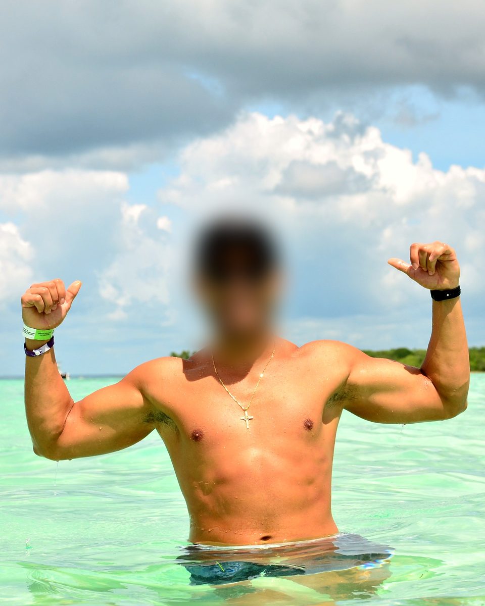 John after cutting, about 65 kg, flexing at the beach